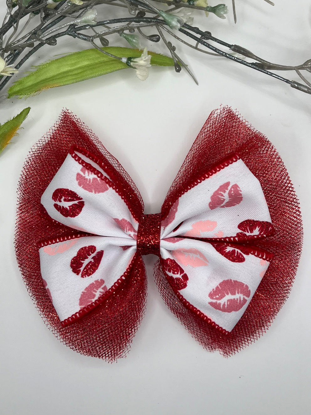 Lip print over red sparkle tulle clip in hair bow
