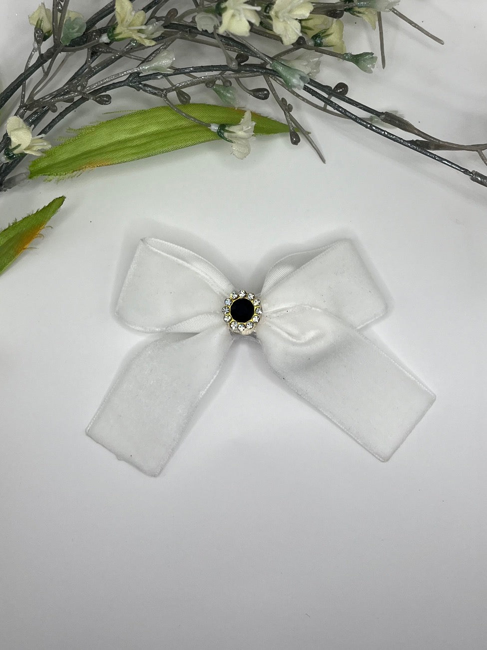 White velvet with rhinestone center cross over clip in hair bow