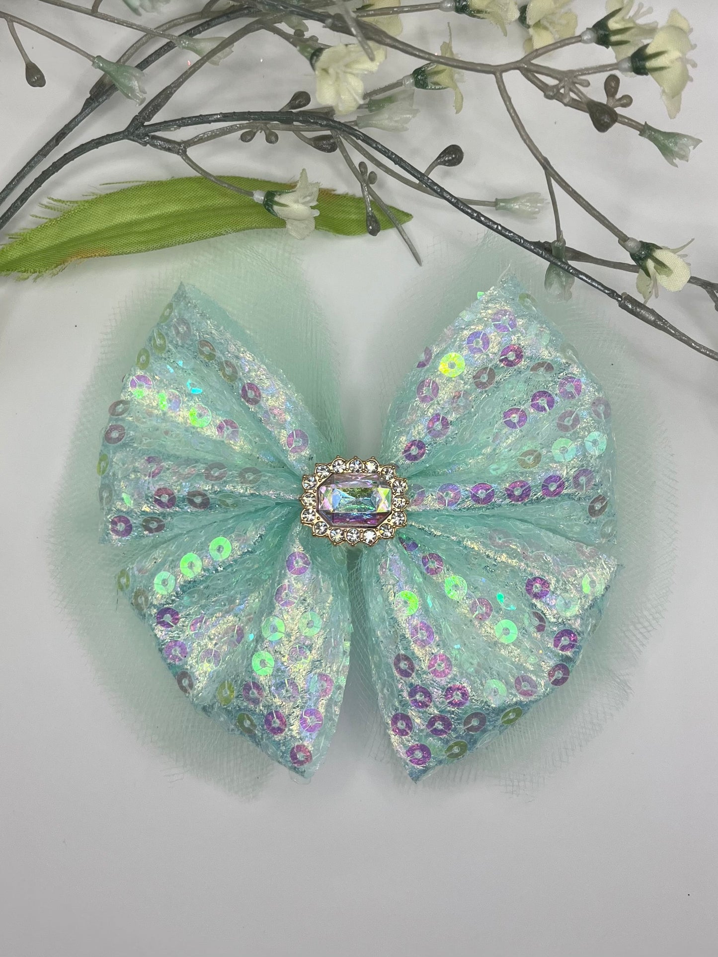 Mint sequin over tulle with rhinestone center clip in hair bow