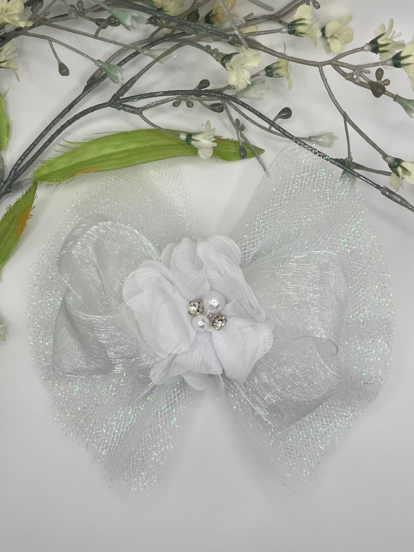 White sparkle tulle with organza and chiffon rhinestone center clip in hair bow