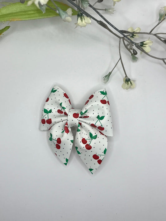 Cherry print faux leather clip in hair bow